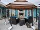 An outdoor patio with outdoor seating and decor, perfect for relaxing and entertaining at 16108 5Th E St, Redington Beach, FL 33708