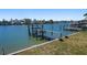Panoramic waterfront view featuring a private boat dock and ample space for multiple boats at 16108 5Th E St, Redington Beach, FL 33708