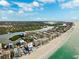 Stunning aerial view of beachfront condominiums along the scenic coastline with beautiful waterways and lush greenery at 19450 Gulf Blvd # 401, Indian Shores, FL 33785