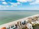 Aerial view of beach homes with a coastal neighborhood and expansive ocean views at 19450 Gulf Blvd # 401, Indian Shores, FL 33785