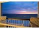 Enjoy sunset views from the balcony with ample seating on the water horizon at 19450 Gulf Blvd # 401, Indian Shores, FL 33785