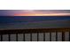 Balcony view featuring ocean sunrise from the outdoor deck at 19450 Gulf Blvd # 401, Indian Shores, FL 33785