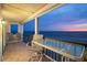 Spacious outdoor balcony featuring comfortable seating with a breathtaking ocean view at 19450 Gulf Blvd # 401, Indian Shores, FL 33785