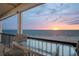 Relax on the balcony with ocean sunset views and ample seating for a peaceful retreat at 19450 Gulf Blvd # 401, Indian Shores, FL 33785