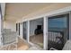 Balcony with sliding glass doors offering breathtaking ocean views and outdoor seating at 19450 Gulf Blvd # 401, Indian Shores, FL 33785