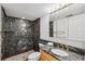 Stylish bathroom featuring a marbled shower and modern vanity at 19450 Gulf Blvd # 401, Indian Shores, FL 33785