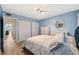 Bright blue bedroom with spacious closet and serene decor at 19450 Gulf Blvd # 401, Indian Shores, FL 33785