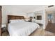 Well-lit bedroom featuring a mirrored closet and stylish furnishings at 19450 Gulf Blvd # 401, Indian Shores, FL 33785