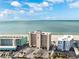 Aerial view of a beachfront high rise with parking at 19450 Gulf Blvd # 401, Indian Shores, FL 33785