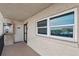 Hallway shows exit, emergency equipment, and large window at 19450 Gulf Blvd # 401, Indian Shores, FL 33785