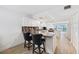 Bright kitchen boasts granite countertops, white cabinets, stainless appliances, and a breakfast bar with seating at 19450 Gulf Blvd # 401, Indian Shores, FL 33785
