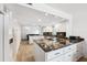 Large kitchen with granite countertops, white cabinets, breakfast bar, and stainless steel appliances at 19450 Gulf Blvd # 401, Indian Shores, FL 33785
