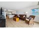 Inviting living room with leather furniture and an open floor plan to the kitchen at 19450 Gulf Blvd # 401, Indian Shores, FL 33785