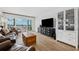 Inviting living room featuring sliding doors to a balcony with ocean views and modern furnishings at 19450 Gulf Blvd # 401, Indian Shores, FL 33785