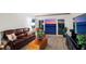 Cozy living room with comfortable seating, ocean view, and access to outdoor balcony at 19450 Gulf Blvd # 401, Indian Shores, FL 33785