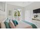 Comfortable bedroom with a large bed, soft pillows, and access to a private balcony at 145 Brightwater Dr # 2, Clearwater, FL 33767