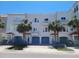 Attractive townhomes with private garages, balconies, and lush tropical landscaping at 145 Brightwater Dr # 2, Clearwater, FL 33767