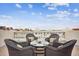 Stylish rooftop deck with decorative stone railing and comfortable seating arrangement at 145 Brightwater Dr # 2, Clearwater, FL 33767