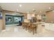 Open-concept kitchen with a large island, white cabinetry, and stainless steel appliances at 1611 San Charles Dr, Dunedin, FL 34698