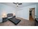 Cozy bedroom with carpet features neutral colors, lamps, and a double closet at 2258 World Parkway W Blvd # 8, Clearwater, FL 33763