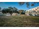 Exterior view of condo building with beautifully maintained lawn at 2258 World Parkway W Blvd # 8, Clearwater, FL 33763