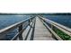 Picturesque wooden dock extending into calm water offers scenic views at 2258 World Parkway W Blvd # 8, Clearwater, FL 33763