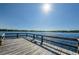 Picturesque wooden dock extending into calm water with a beautiful view at 2258 World Parkway W Blvd # 8, Clearwater, FL 33763