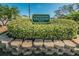 On Top Of The World golf course sign with lush landscaping and brick border at 2258 World Parkway W Blvd # 8, Clearwater, FL 33763