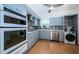 Well-equipped kitchen with updated appliances, ample storage, and convenient laundry area at 2258 World Parkway W Blvd # 8, Clearwater, FL 33763