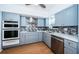 Modern kitchen featuring stainless steel appliances, sleek cabinetry, and stylish backsplash at 2258 World Parkway W Blvd # 8, Clearwater, FL 33763