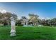 Beautiful landscaped lawn featuring statues and trees at 2258 World Parkway W Blvd # 8, Clearwater, FL 33763