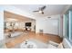 Bright and open living room with wood floors features modern furniture and a dining area at 2258 World Parkway W Blvd # 8, Clearwater, FL 33763