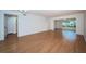 Spacious living room featuring hardwood floors and a versatile layout at 2258 World Parkway W Blvd # 8, Clearwater, FL 33763
