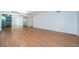 Bright and open living room with wood floors shows a clean and minimalist space at 2258 World Parkway W Blvd # 8, Clearwater, FL 33763