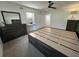 Spacious main bedroom featuring a custom bed frame, carpet, and bright natural light at 2258 World Parkway W Blvd # 8, Clearwater, FL 33763