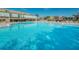 A bright blue swimming pool perfect for a refreshing swim and relaxation on a sunny day at 2258 World Parkway W Blvd # 8, Clearwater, FL 33763