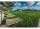 Inviting grassy lawn area with lounge chairs for relaxing at 2258 World Parkway W Blvd # 8, Clearwater, FL 33763
