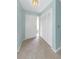 Bright foyer featuring tile flooring, a closet, and a front door with a sidelight window at 435 Meadowlark Ln, Palm Harbor, FL 34683
