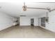 Large garage space with concrete floor and multiple entry points at 435 Meadowlark Ln, Palm Harbor, FL 34683