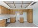 Kitchen featuring wood cabinets, and tile flooring at 435 Meadowlark Ln, Palm Harbor, FL 34683