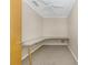 Versatile office space with a built-in desk, ceiling fan, and neutral walls at 435 Meadowlark Ln, Palm Harbor, FL 34683