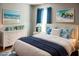 Stylishly staged bedroom featuring a comfortable bed, dresser, and nautical themed accents at 5426 Rushmere Ct, Palmetto, FL 34221