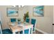 Cozy dining room with seating for six, beach decor, and ample natural light at 5426 Rushmere Ct, Palmetto, FL 34221