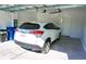 Spacious two car garage with ample space and a well-maintained floor at 5426 Rushmere Ct, Palmetto, FL 34221