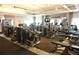 Spacious gym complete with weight machines, treadmills, and tvs for an optimal workout experience at 5426 Rushmere Ct, Palmetto, FL 34221