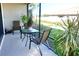 Cozy screened-in lanai featuring a table and chairs, perfect for enjoying the outdoors at 5426 Rushmere Ct, Palmetto, FL 34221
