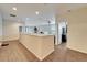Spacious hallway featuring wood-look tile flooring and leads to a bedroom and exercise area at 12610 Geneva Glade Dr, Riverview, FL 33578