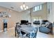 Open-concept living room with high ceilings, dining set, and tile flooring at 12610 Geneva Glade Dr, Riverview, FL 33578