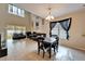 Bright, open-concept living space featuring tile floors, large windows, a dining area, and comfortable seating at 12610 Geneva Glade Dr, Riverview, FL 33578