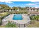Aerial view of a sparkling community pool with lounge chairs and manicured landscaping at 2700 Nebraska Ave # 3-201, Palm Harbor, FL 34684